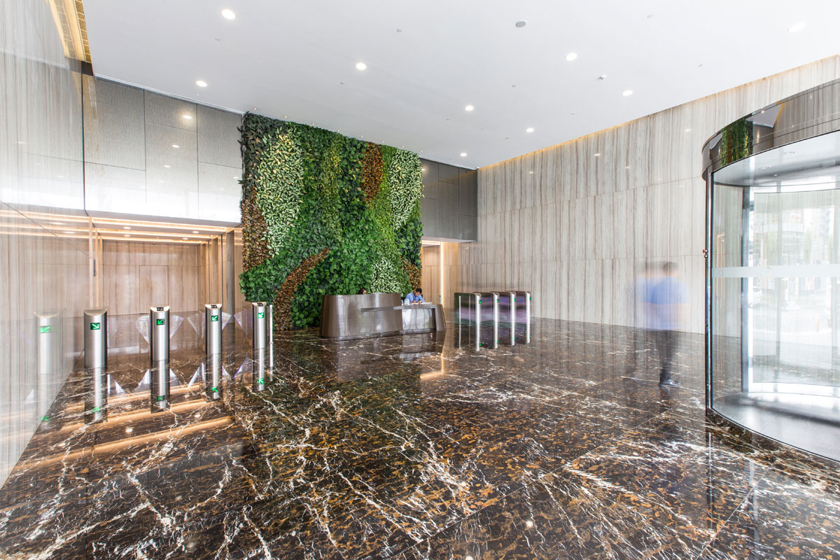 SCAPE-scape lobby area is refined with the rich wall-to-floor natural stone finish