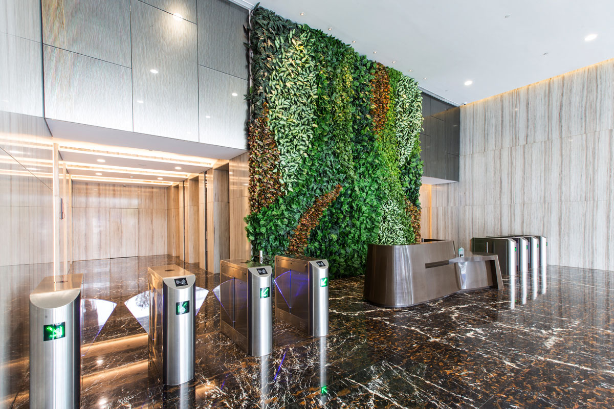 SCAPE-scape lobby area with a furnished green-patterned wall